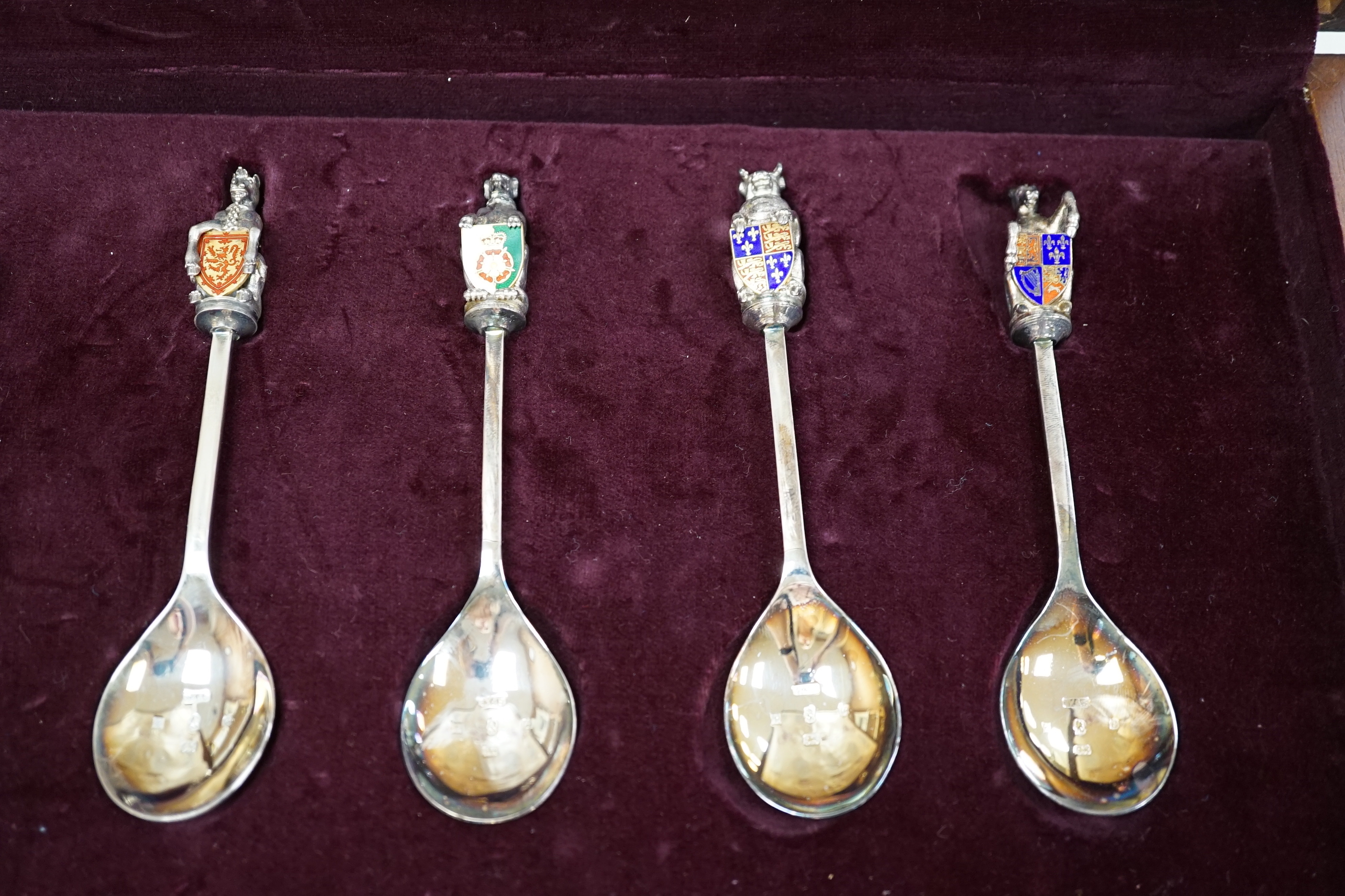 A modern limited edition cased set of ten silver and enamel 'The Queens Beasts Spoons', by Toye, Kenning & Spencer, no. 345/2500.